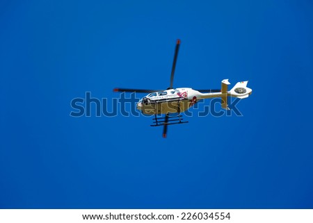 Brasov, Romania - August 12, 2010: TV news helicopter on a blue sky