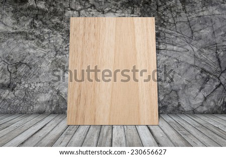 wood board on grunge wallpaper with wooden table