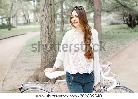 Girl on a bike ride with a retro hipster bike