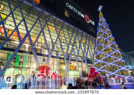BANGKOK, THAILAND - NOVEMBER 30, 2014 : Big Christmas tree and snoopy doll at Central World shopping mall at night.