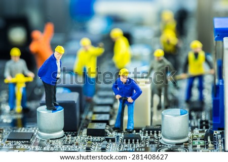 Boss and Team of engineers repairing circuit mother board. Computer repair concept
