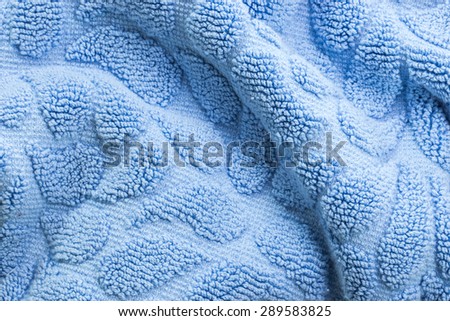 Texture of oval shape light blue cotton bath towel