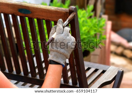 Similar – Image, Stock Photo Glaze. Woodwork, painting wood. Hand of the craftsman painting a wooden door. Concept of renovation work, carpentry and woodwork. painter, painting wooden surface, wood preservation