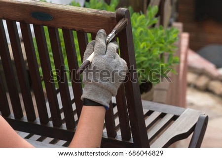 Similar – Image, Stock Photo Glaze. Woodwork, painting wood. Hand of the craftsman painting a wooden door. Concept of renovation work, carpentry and woodwork. painter, painting wooden surface, wood preservation