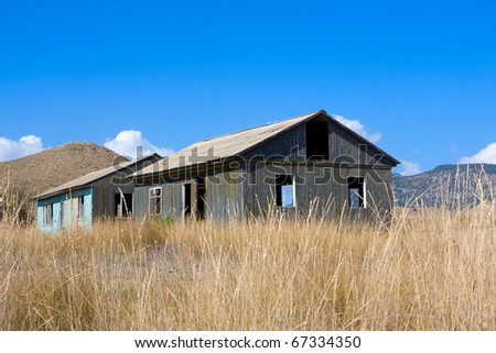 Two old abandoned houses in mountains