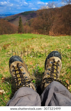 Hiking Feet over valley in mountains