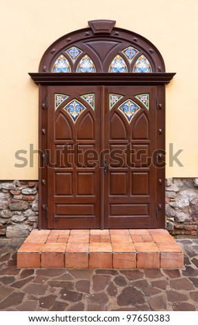 nice brown door with stoned porch