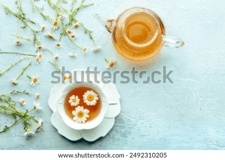 Similar – Foto Bild Frische Blumen im Becher auf Holztisch