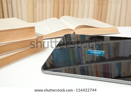 E-learning with e-book concept. Digital tablet in study room with button e-book on touch screen.