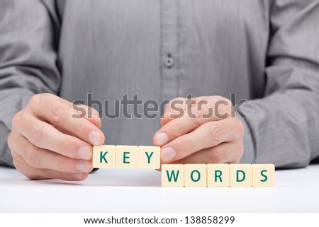 Keywords concept. Man complete word keywords.
