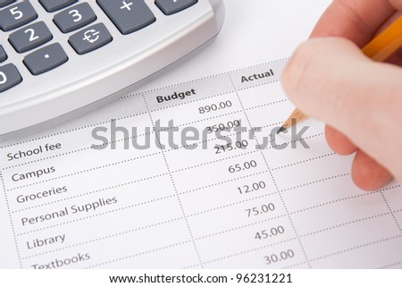 Student\'s budget concept - printed budget and student write in chart actual values.