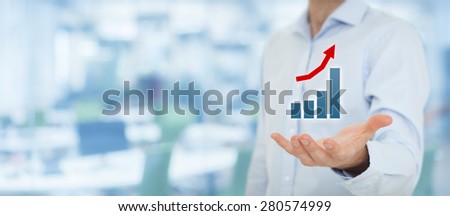 Businessman hold graph illustrating positive progress, growing income, and success. Wide banner composition.