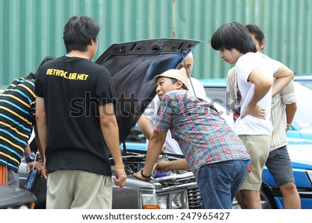 THAILAND - APRIL 5: An unidentified men visit retro car motor show on April 5,2014 in Bangkok, Thailand. The festival is meeting retro car user of Thailand.