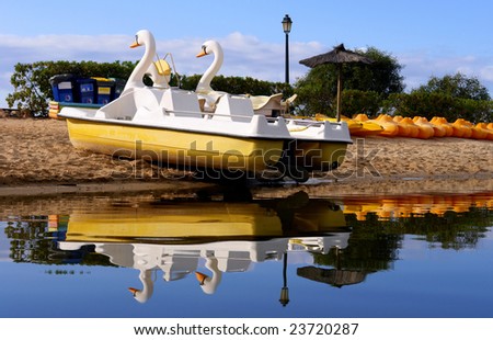Recreation fun boats and reflex, in turist resort lake shore, Algarve, Portugal