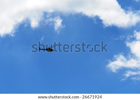 Helicopter flight in sky background
