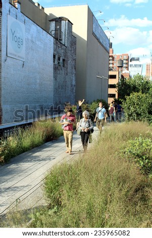 NEW YORK CITY - SEPTEMBER 03: People at High Line Park in NYC on September 03th, 2013. High Line is a public park built on historic freight rail line elevated above streets of Manhattan West Side.