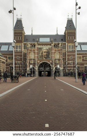AMSTERDAM, NETHERLANDS - FEBRUARY 08: Visitor at Rijksmuseum exterior on February 08, 2015 in Amsterdam. The Rijksmuseum is located at the Museum Square, first opened its doors in 1885.