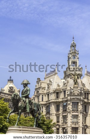 PORTO, PORTUGAL - JULY 04, 2015: Liberdade square monument of King Pedro IV statue in Aliados Avenue, one of the most popular tourist destinations in Europe, on July 04, 2015 in Porto, Portugal.