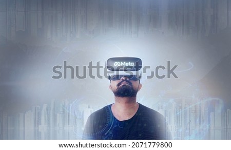 Meta Written On The Googles - Man Wearing Virtual Reality Goggles Inside A Metaverse Looking Upside
 Photo stock © 