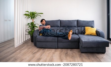 Similar – Image, Stock Photo Man lying down holding mirror with reflection