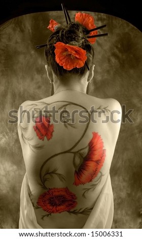 beautiful young asiatic girl with red poppies in her hear and tatto on her back