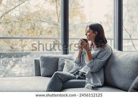 Similar – Image, Stock Photo Dreamy girl sitting on chair near window