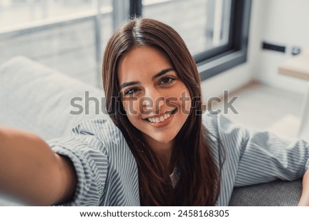 Image, Stock Photo Cheerful woman taking selfie on smartphone in city