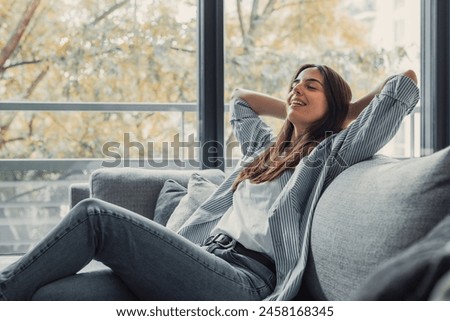 Similar – Image, Stock Photo Pretty young woman takes a break after running in the urban area