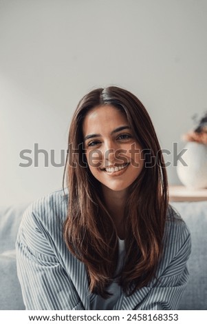 Similar – Image, Stock Photo Woman young looking at smartphone sitting on a beach rock