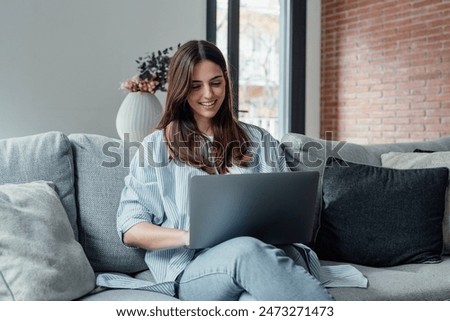 Similar – Image, Stock Photo Woman browsing laptop during online shopping at home