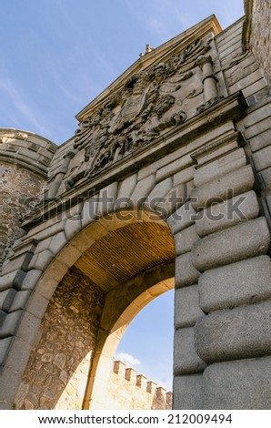 Detailed view of Bisagra gate with the coat of arms in the imperial city of Toledo.