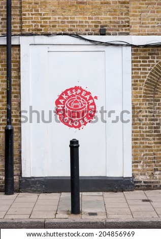 LONDON, UK / CIRCA JUNE 2014 - Logo of Shakespeare\'s famous Globe Theater, seen on a white wall on the Southbank