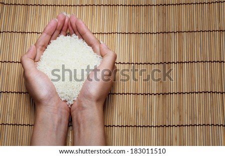 japanese rice in your hand on Japanese mats
