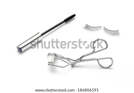 Fake false eyelash with eyelash curler and mascara Isolated on white background