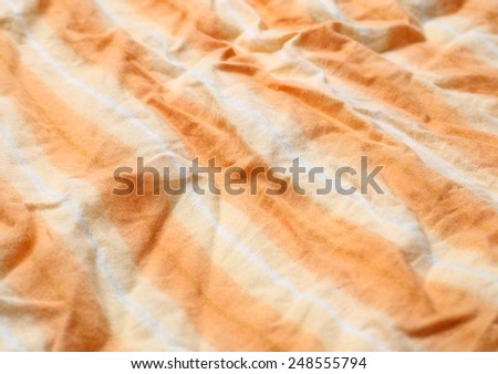 the wrinkled of clothes pattern orange color for background