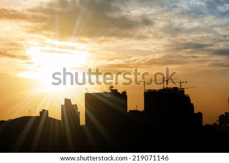 City silhouette with sun star flare
