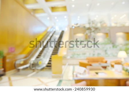 Abstract blurry bright empty reception area in warm light ambient
