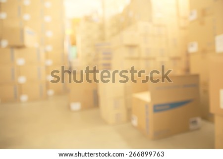 Abstract blurry warehouse storing a lot of stack of large box background