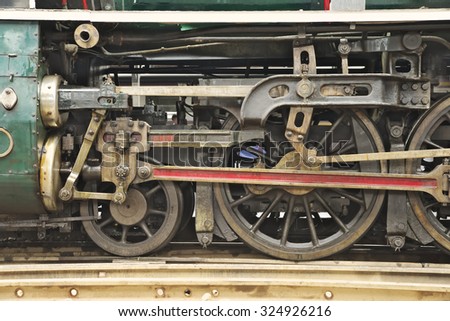 Closeup of train engine\'s wheel on the rail