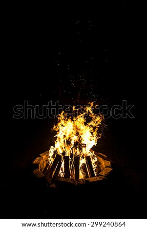 Photo of campfire by night on black background