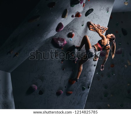 Similar – Image, Stock Photo Woman rock climbing indoors.