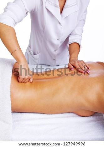 Therapist is doing a lower back massage