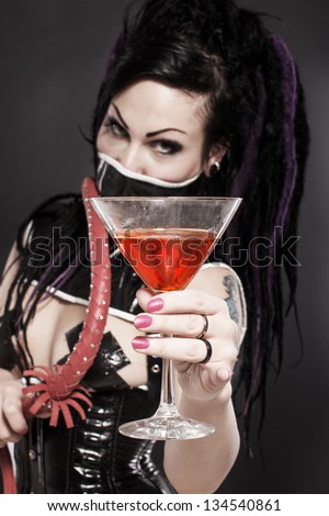 Image of gothic woman in underwear and with whip