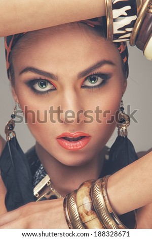 A young model with tribal accessories