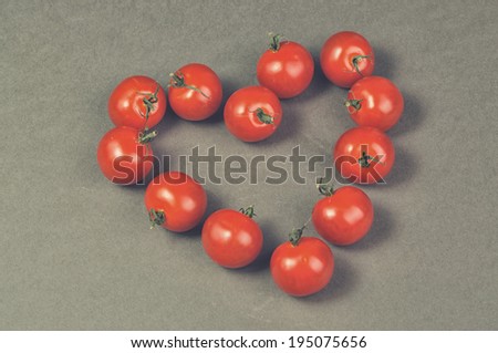 tomatoes close up in the shape of a heart