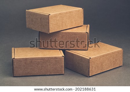 brown carton boxes on grey background