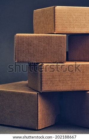 brown carton boxes on grey background