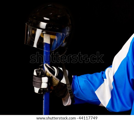 Picture of hockey helmet  and stick