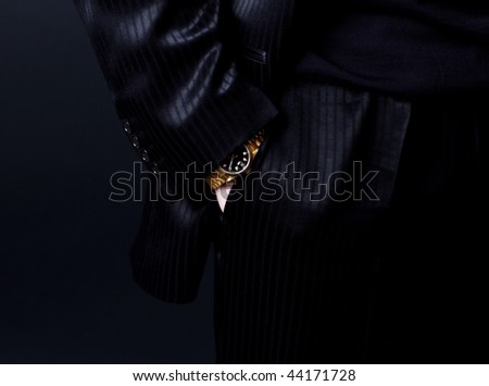 Picture of part of body in expensive suit