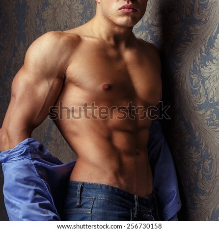 Fashion portrait of man body in blue shirt.